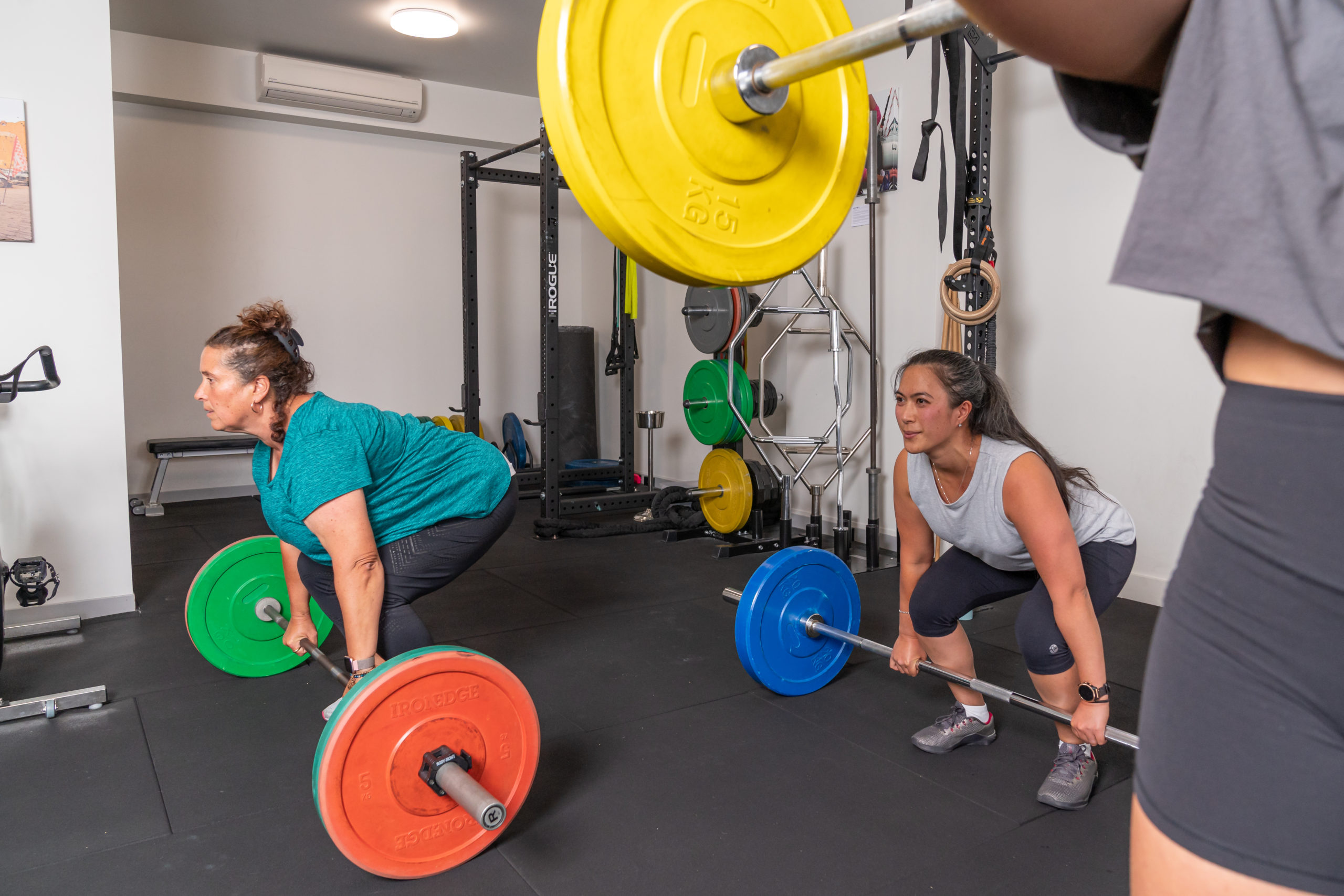 Women Lifting Weights in Small Group Strength Class