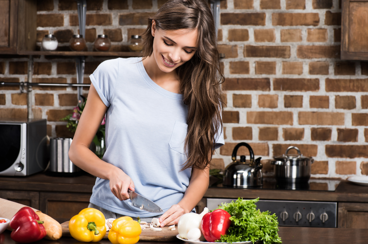 woman cooking healthy food as part of healthy lifestyle
