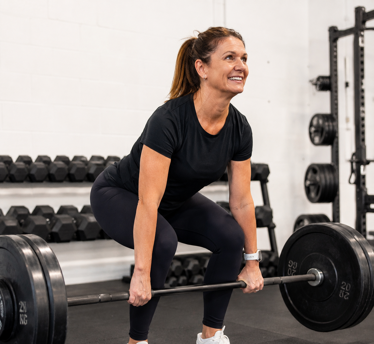 woman in her 40s strength training strength training with weight